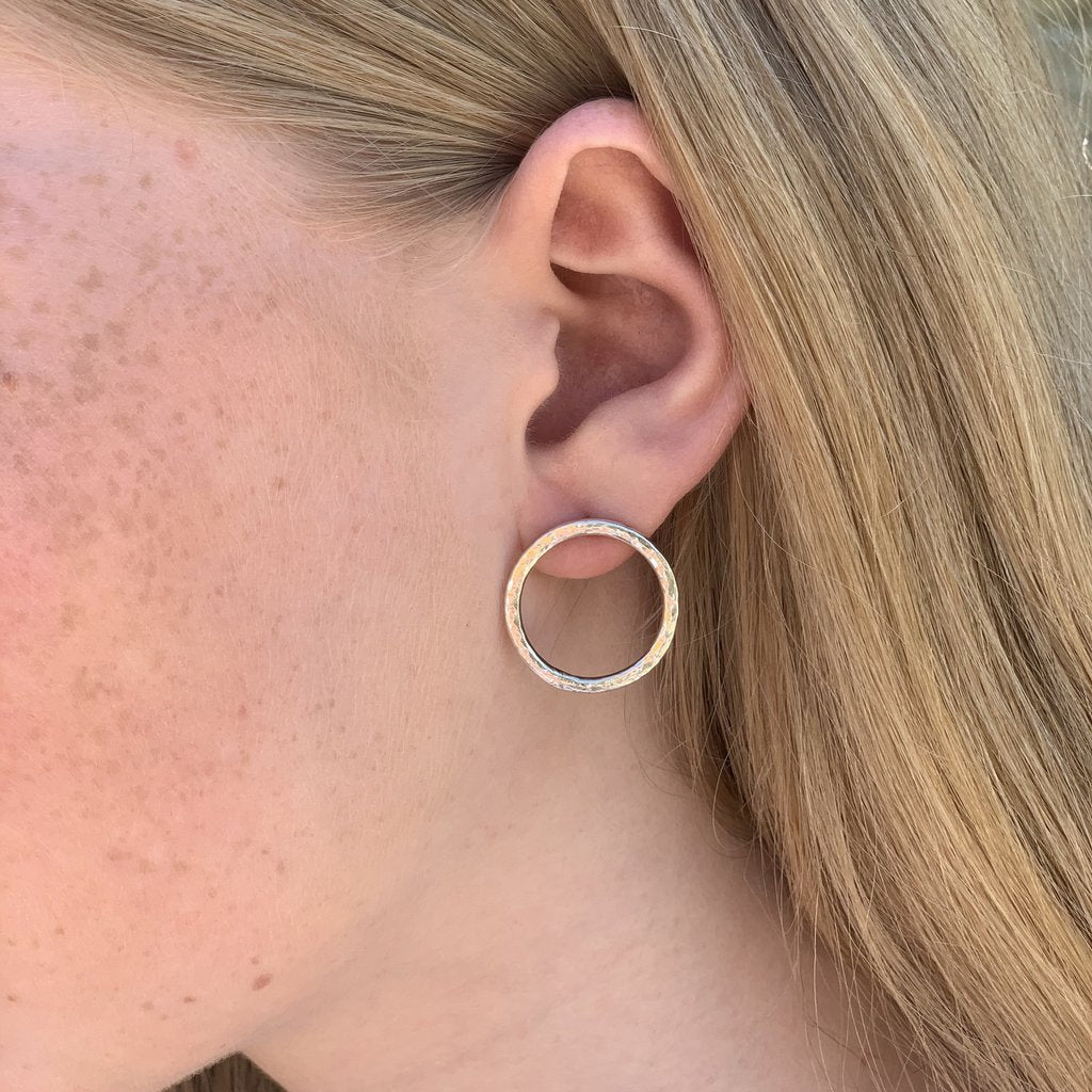 Caldera Cirque Stud Earrings - handmade silver earrings with hammered finish - medium modelled