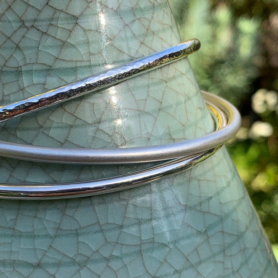 Alambra handmade silver bangle collection - close-up