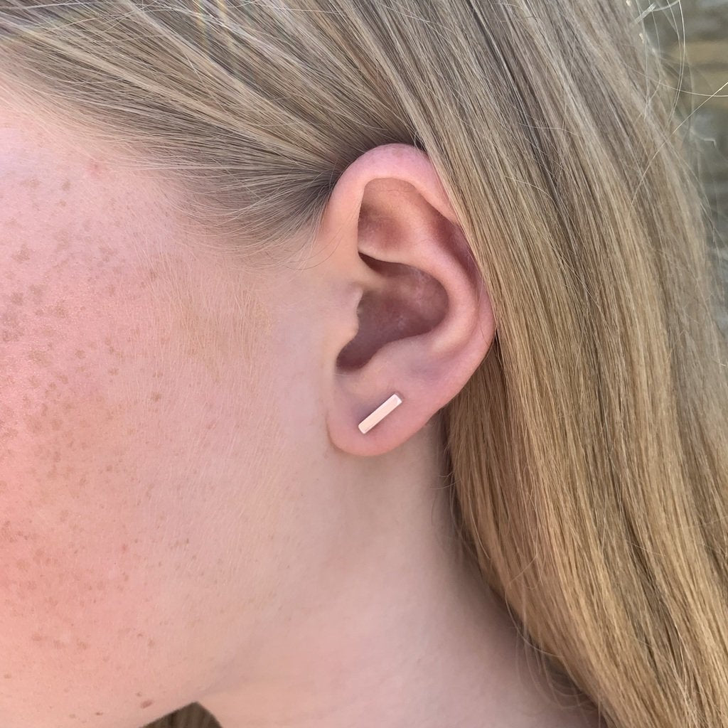 Barra handmade silver bar stud earrings - modelled along ear