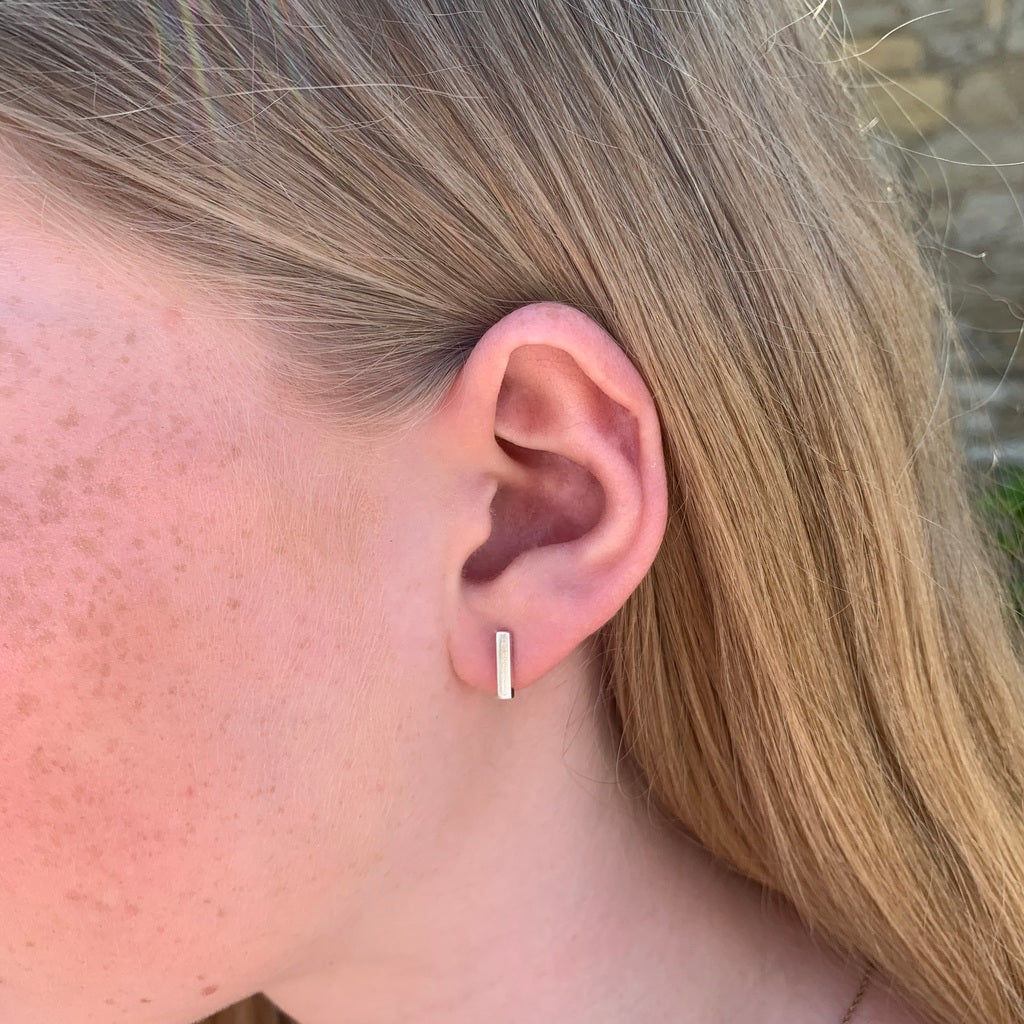 Barra handmade silver bar stud earrings - modelled vertical