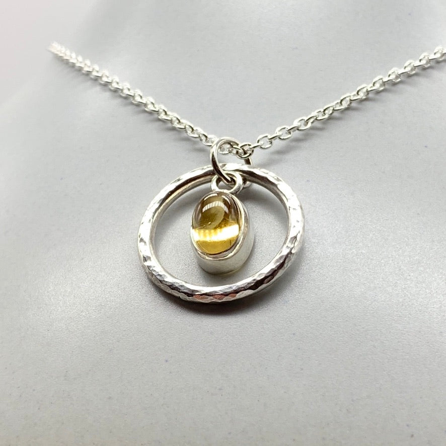 Oval cabochon citrine pendant necklace in silver hammered ring