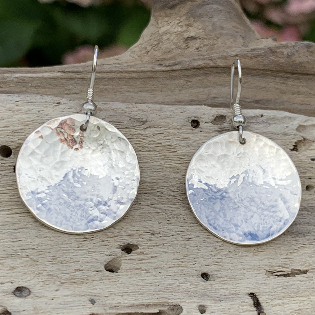Caldera Lunelle hammered silver earrings on driftwood
