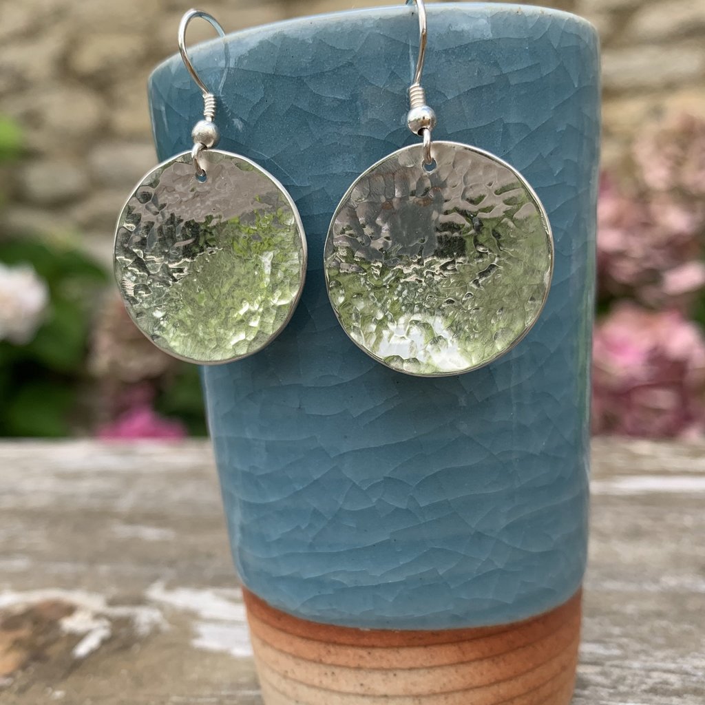 Caldera Lunelle hammered silver earrings on japanese tea cup