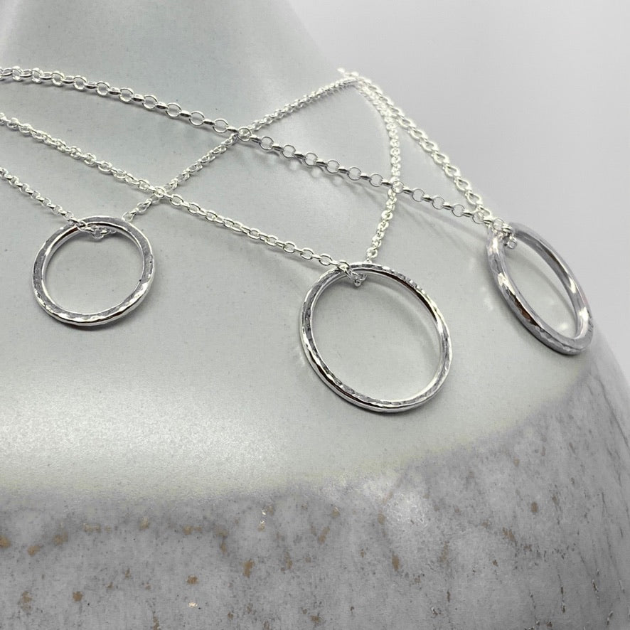 Caldera Soltera circle pendant necklace collection