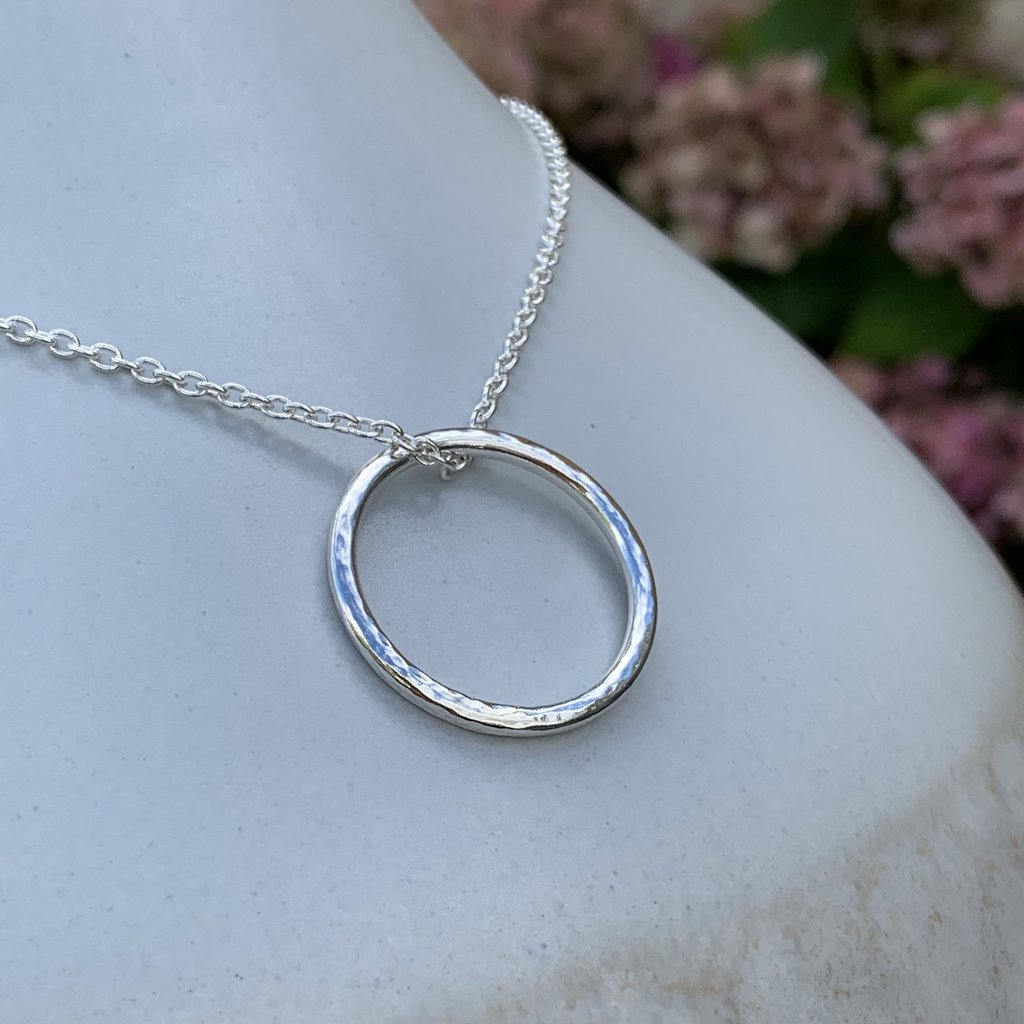 Caldera Soltera circle pendant necklace in sterling silver - lighter style - close-up