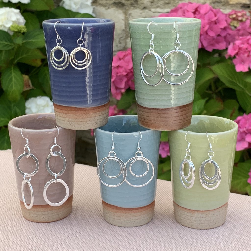Caldera handmade silver earring collection on Japanese tea cups