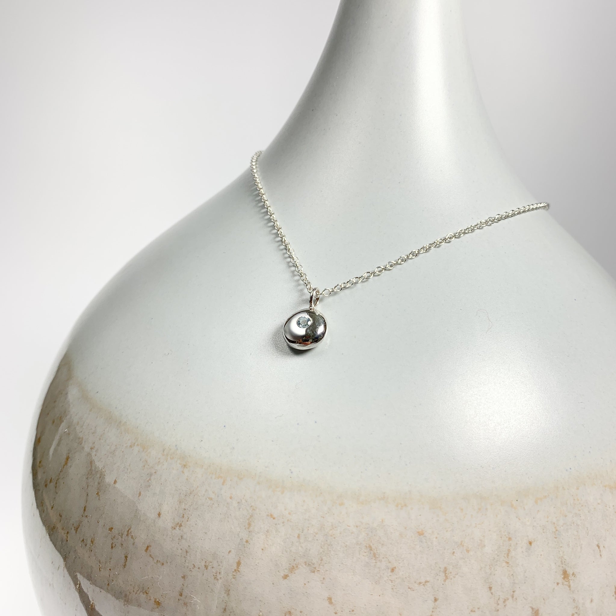 Sterling Silver Pebble Charm Pendant with Sky Blue Topaz